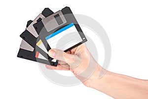 Female hand holding floppy disks