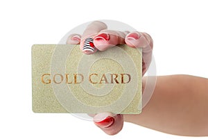 Female hand holding gold credit card isolated