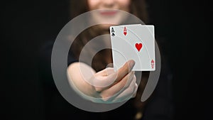 Female hand holding hearts and clubs aces, card pair, advantage, win chance