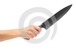 Female hand holding a huge sharp knife