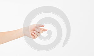 Female hand holding invisible items, woman`s palm making gesture while showing small amount of something on white isolated backgr photo