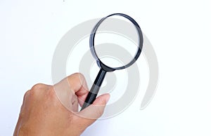 Female hand holding  Magnifying glass  isolate on a white background