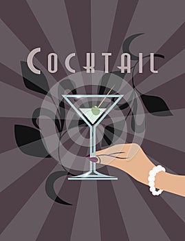 Female hand holding Martini cocktail