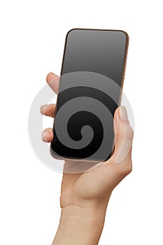 Female hand holding modern mobile phone with black screen isolated at white background. Cellphone mockup. Vertical image