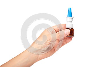 Female hand holding nose spray bottle. on white background