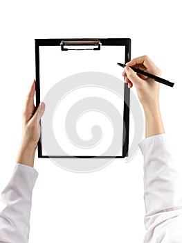 Female hand holding a pen and clipboard with blank paper (docume