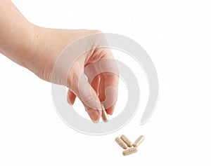 Female hand holding pill