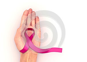 Female hand holding pink ribbon. 3d render