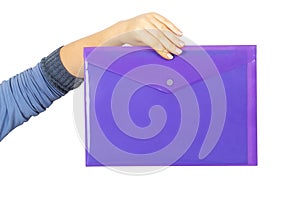 Female hand holding a purple plastic folder