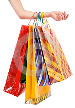 Female hand holding shopping bags