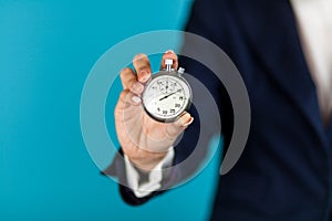 Female hand holding a stopwatch