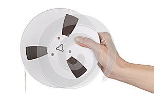 Female hand holding Tape of reel tape recorder