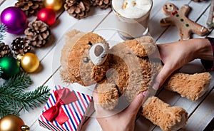 Female hand holding a teddy bear