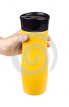 Female hand holding a thermo mug