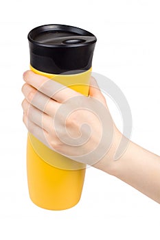 Female hand holding a thermo mug