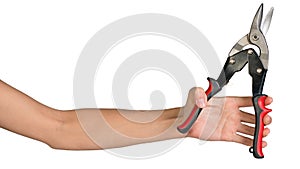 Female hand holding tin snips