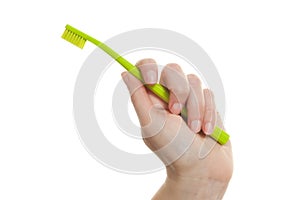 Female Hand Holding Toothbrush
