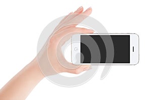 Female hand holding white smart phone in landscape orientation
