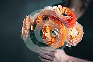 Female hand holds beautiful bouquet of ranunculus. Mothers day, holiday decor, Flower delivery concept. Generative AI