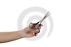 Female hand holds hairdresser scissors isolated on white background