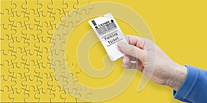 Female hand holds a parking ticket - parking payment concept on solid colored background - concept image in jigsaw puzzle shape photo