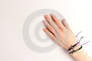 Female hand with a macrame bracelets.