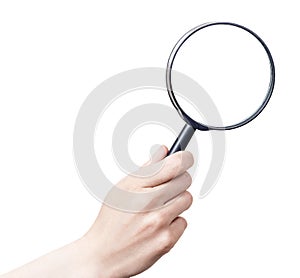 Female hand with magnifying glass.