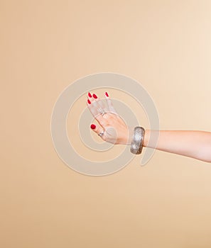 Female hand with manicure and armlet