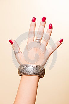 Female hand with manicure and armlet