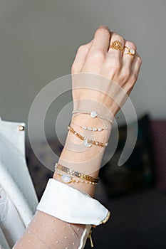 Female hand with manicure and bracelet armlet ring jewellery