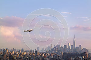 Female hand with mobile phone take picture of midtown of Manhattan. Plane flies over skyscrapers of New York City, Manha photo