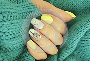 female hand nail beautiful manicure, sweater