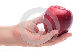 Female hand offeing a red Macintosh apple