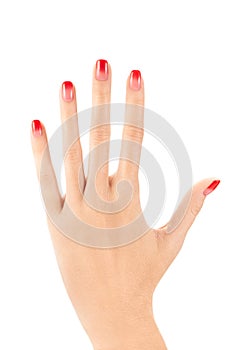 Female hand with ombre nail design on white background