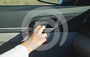 Female hand open car door from inside