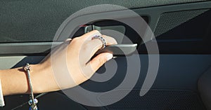 Female hand open car door from inside