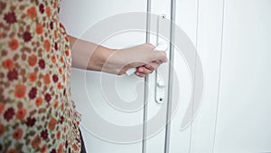 Female hand open doors