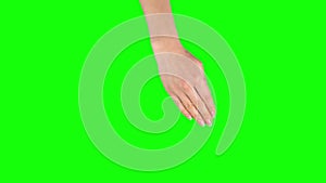 Female hand is performing 5x rotate left and right at tablet screen gesture on green screen. Close up