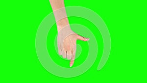 Female hand is performing Press and drag at tablet screen gesture on green screen. Close up