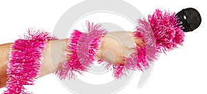 Female hand with pink garland holding a microphone