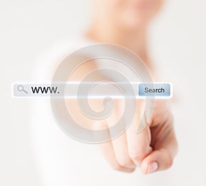 Female hand pressing Search button