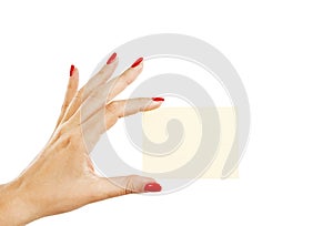 Female hand with red nails holding a blank card