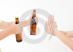 Female hand reject a bottle of beer isolated on white background.anti alcohol concept. Copy space