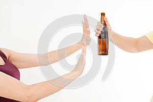 Female hand reject a bottle of beer isolated on white background.anti alcohol concept. Copy space