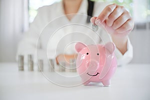 Female hand saving money for future retirement plan