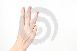 Female hand showing three fingers isolated on white background