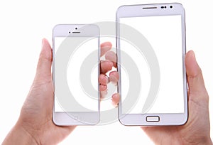 Female hand showing two different smart phone blank screen