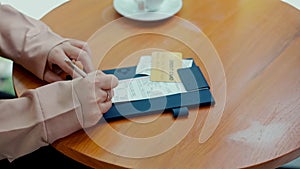 Female hand sign in slip paper of credit card