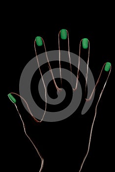 Female hand silhouette with phosphorescent nail polish