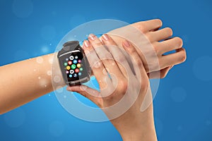 Female hand with smartwatch and app icons